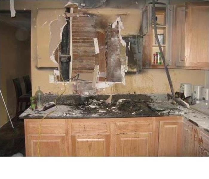 This kitchen wall is covered in soot and smoke damage and required a full demolition