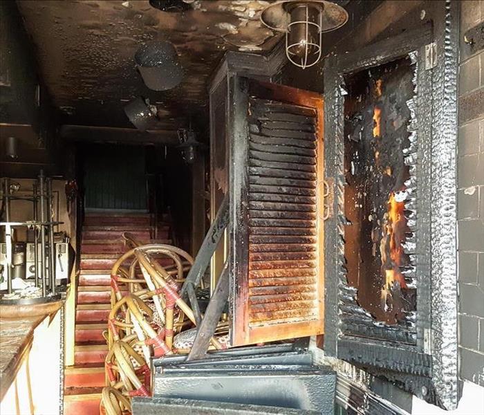 burnt contents and chairs in a restaurant 
